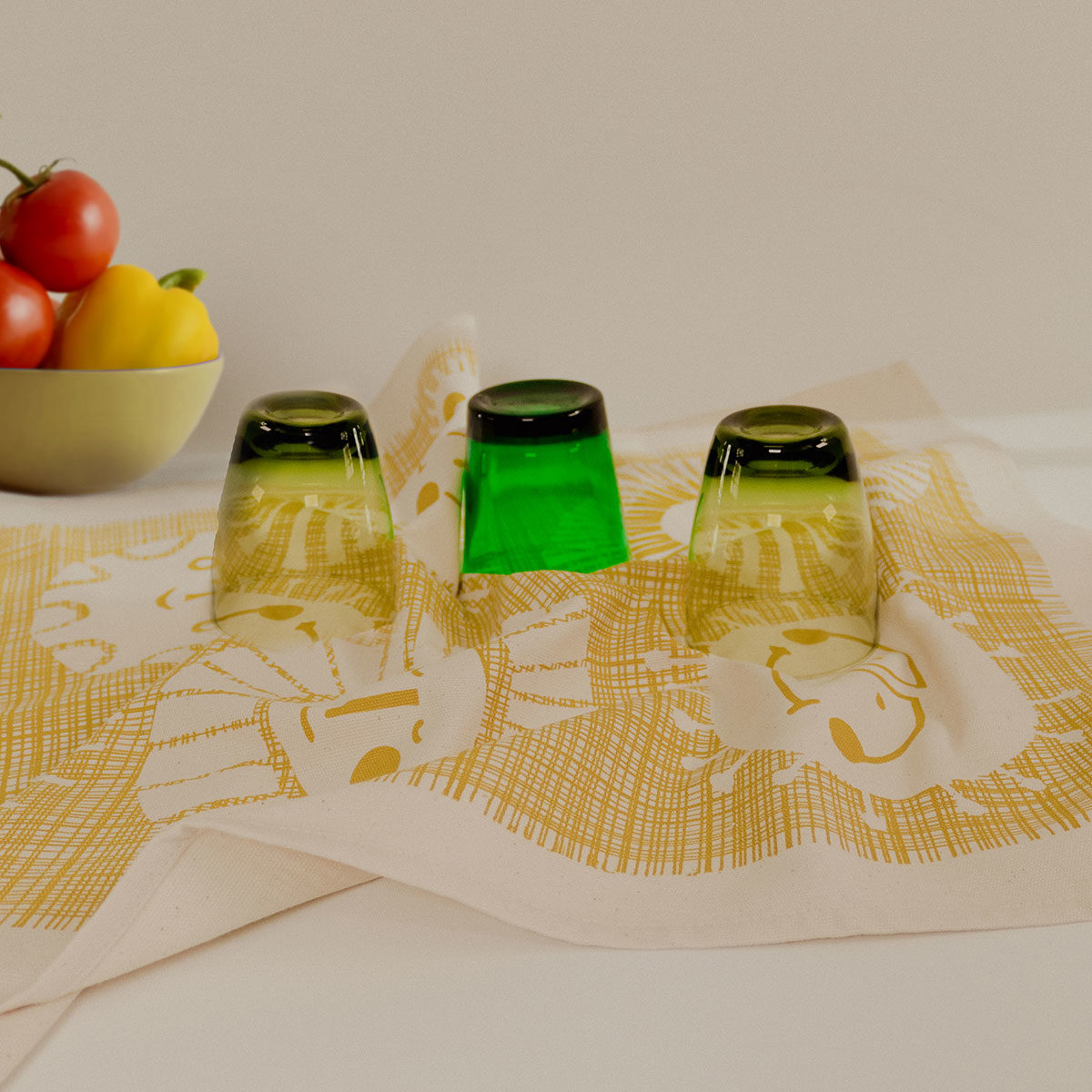 Sunnyside Tea towel by Skinny laMinx being used to dry glassware
