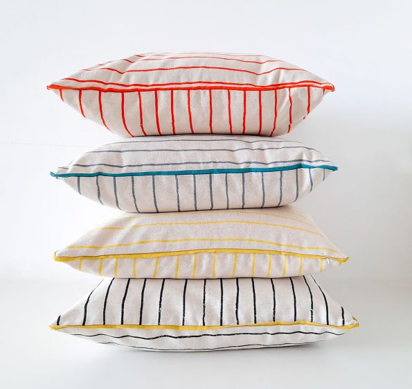 Piped cushions in Simple Stripe print by Skinny laMinx