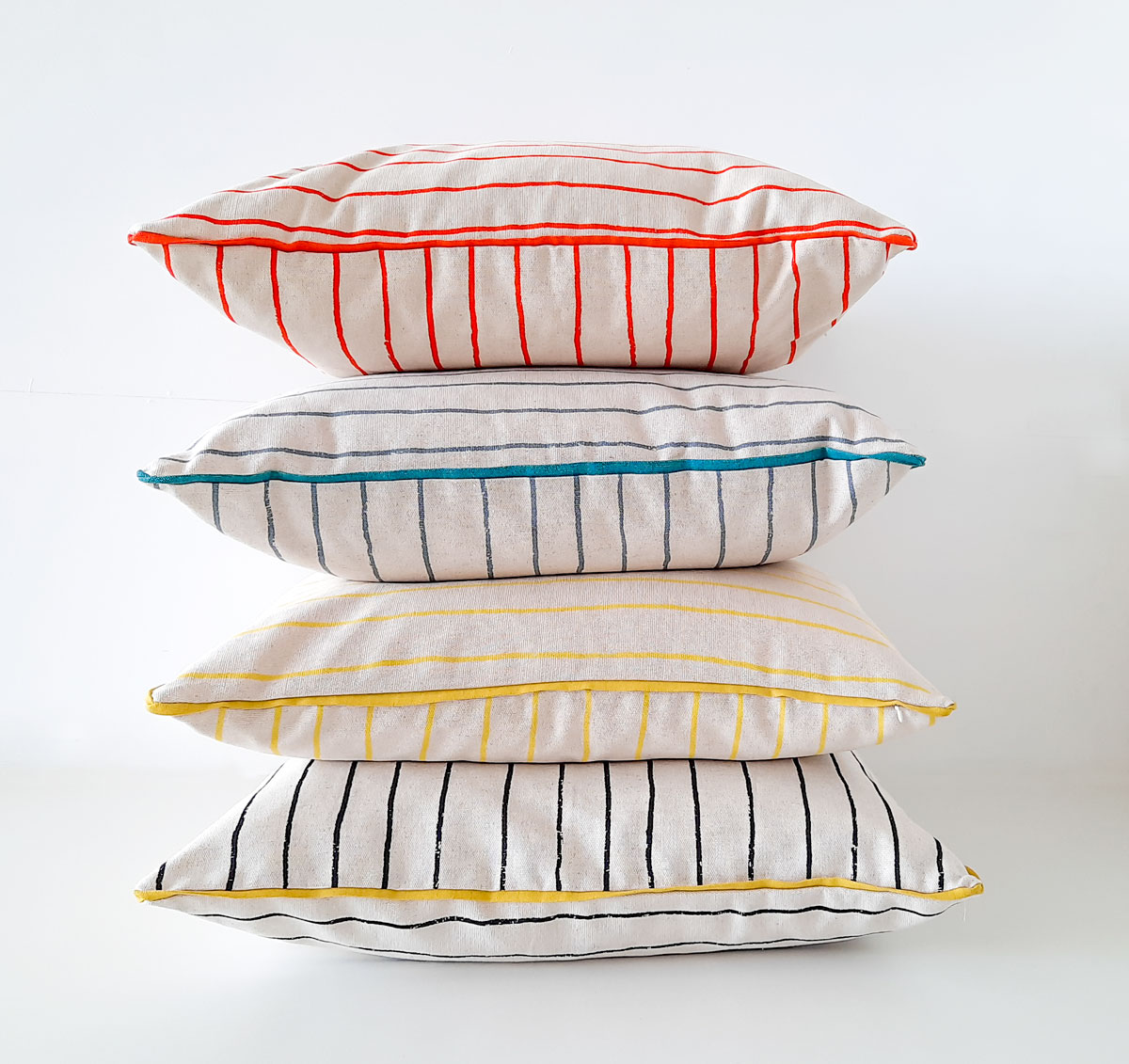 Piped scatter cushions in Simple Stripe print by Skinny laMinx